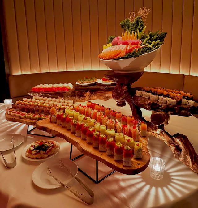 Luxury sushi catering display at a prestigious New York City event featuring premium nigiri and artisan rolls