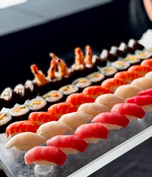 Line of premium nigiri sushi including salmon tuna and shrimp for NYC catering