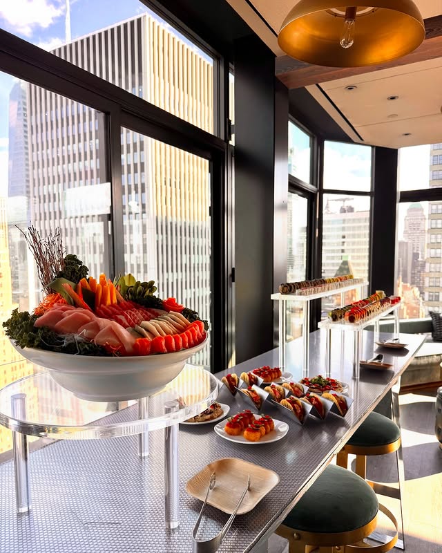 Corporate sushi catering setup in Manhattan high-rise with stunning skyline views