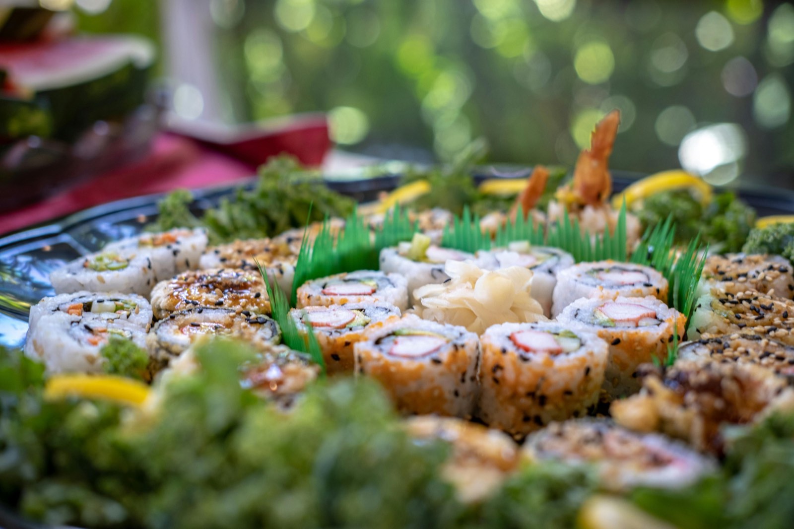 Large sushi platter with assorted rolls arranged for a party catering event in NYC